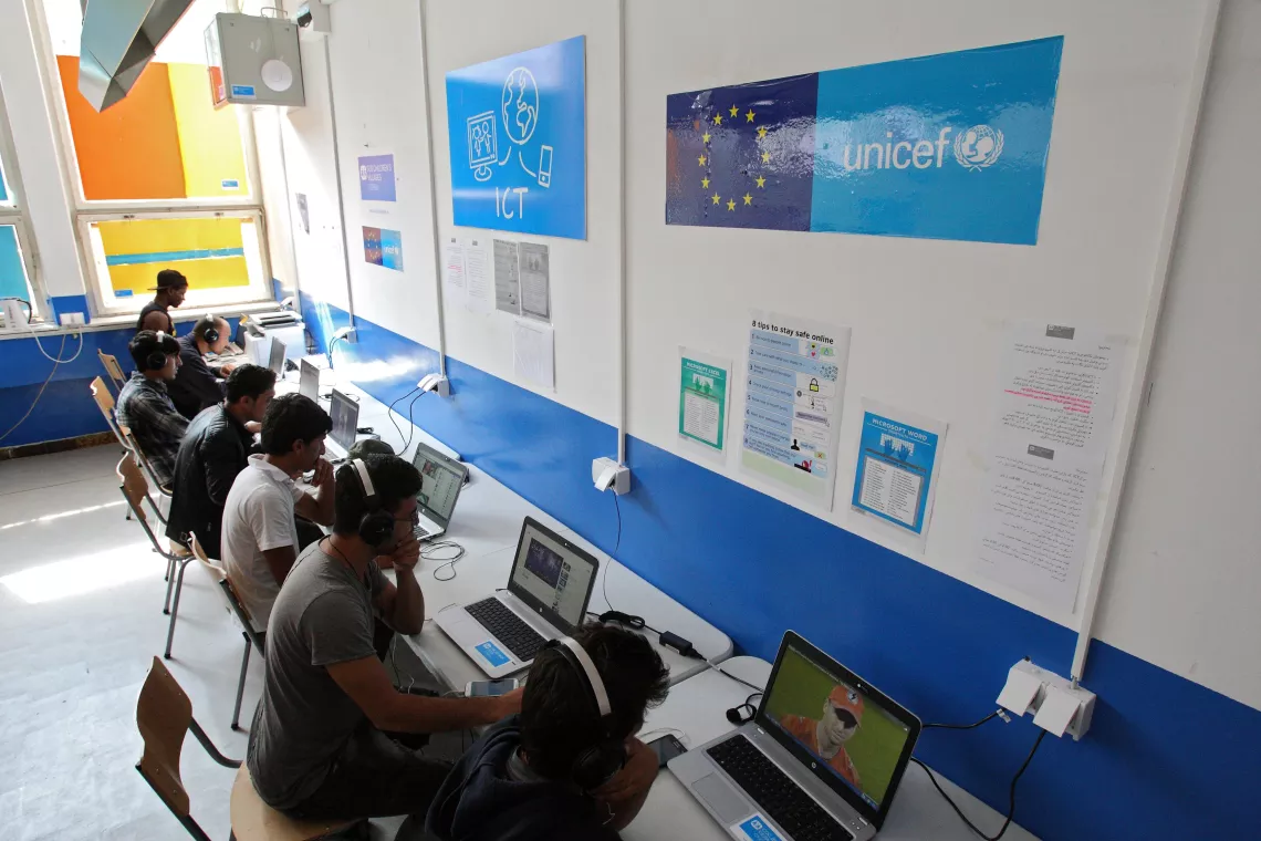 Children are learning computer skills in the ICT corner in the Reception center in Obrenovac. 